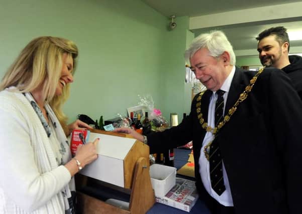 The Mayor of Chichester Peter Budge buying a raffle ticket.ks16000568-4 SUS-160417-165708008