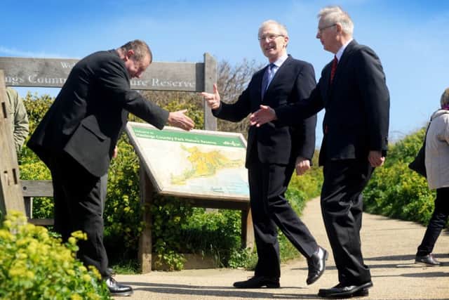 Hastings Borough Council tourism manager Kevin Boorman bows as he greets the prince and Lord Leiutenant of East Sussex Peter Field on East Hill
