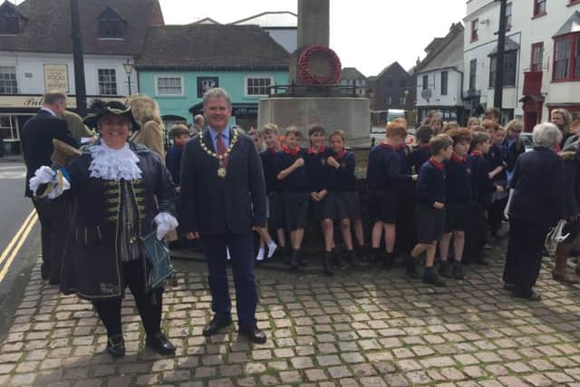 Arundel town clerk Amanda Finnamore, councillor Anne Harriet and schoolchildren from St Philip's Catholic Primary School joined in the celebration