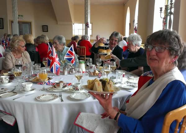 Chairman Dorothy Allwright with the sandwiches at the Exel Retired Staff Association afternoon tea for the Queen's birthday