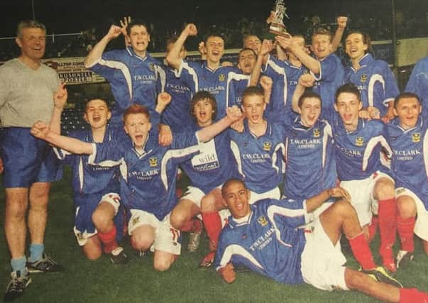 The Portsmouth Schools team celebrate winning the English Schools Football Associations Under-15 Inter Association Trophy in 2004 with team manager Graham Bryant, far left