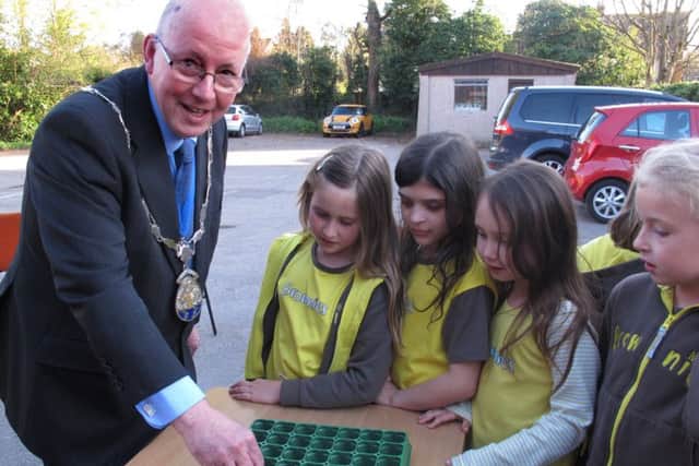 Horley Town Mayor Cllr Richard Olliver joins the 7th Horley Brownies and friends to be taking part in the the Rocket Science experiment planting seeds that have been in space woith British astronaut Tim Peake - picture submitted by