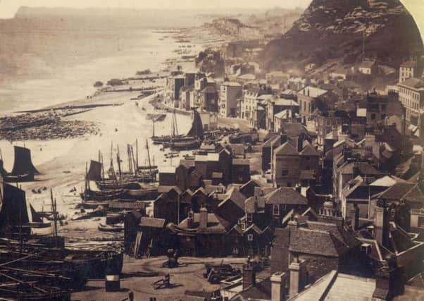 This view from the East Hill dates from the mid 1860s, in the right foreground are Lindsell Cottages newly built for the Hastings Cottage Improvement Society in 1862. Notice how close to the houses the shoreline is and the horse-capstans in the foreground. The registration letters of the fishing boats changed around this time and some can still be seen sporting their pre-RX registrations of RE. Bathing machine can bee seen at the waters edge in the distance.