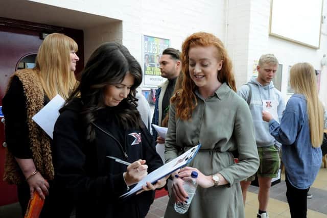 Paige Howard signs in Jodie Walcott for the X factor auditions.ks16000584--1 SUS-160423-223021008