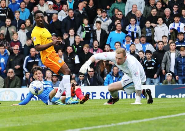 Conor Chaplin scores Pompey's second goal against Wycombe on Saturday Picture: Joe Pepler