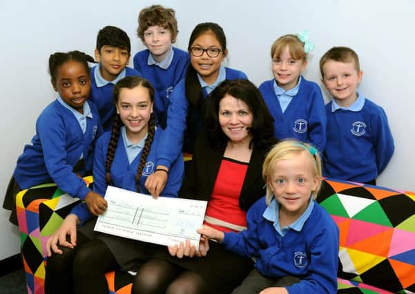 Debra Turner (headteacher) of St Francis of Assisi, Crawley with some of the children who have raised nearly Â£ 3,000 for charities. Pic Steve Robards SR1611868 SUS-160425-160336001