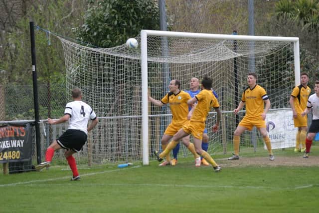 YM`s Kevin Burgess (No.4) piles on the pressure in Chichester City goalmouth. Photo by Clive Turner
