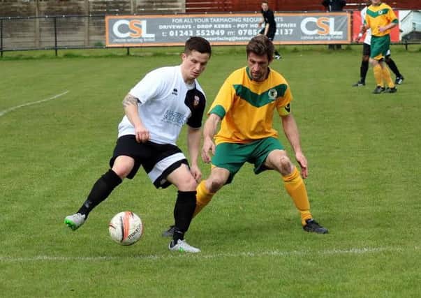 Pagham v Horsham. Scott Murfin and Joe Shelley in action. Pictures by Roger Smith