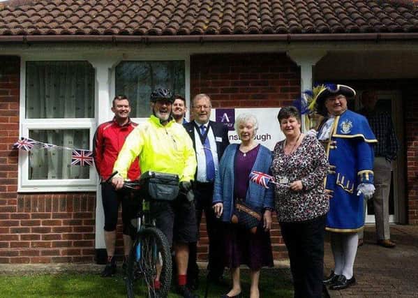 Terry Keen with his sons, resident May Seaman, estate manager Nicola Davie, deputy mayor SeanMcDonald and town crier Bob Smytherman