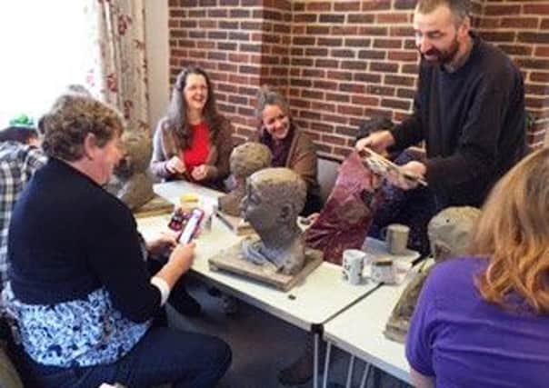 Members of Chichester and Bognor Regis branch of the MS Society working on sculpture heads for a display at Pallant House in December