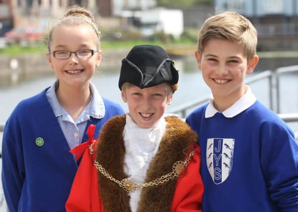 Junior Mayor Sam Corbett and Junior Councillors William Shears and Lucy Campbell shadow Chichester Mayor Peter Burge and Mayoress Philippa Budge for the day. Pictured at Chichester Canal Basin. Photo by Derek Martin