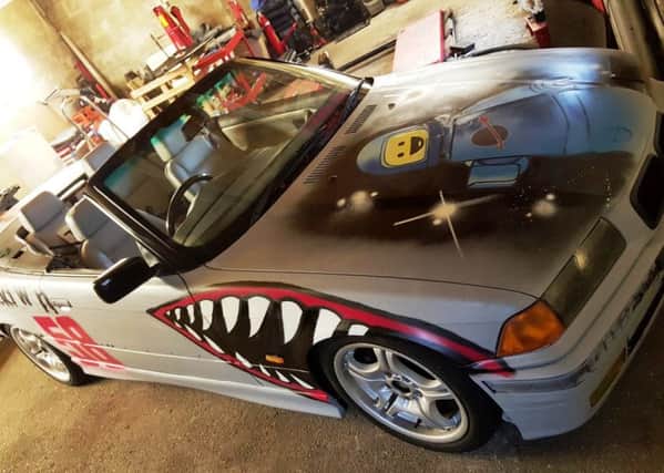 Urban artist Red-E donated his time and skills to decorate the BMW 328i cabriolet for Scumrun 2016