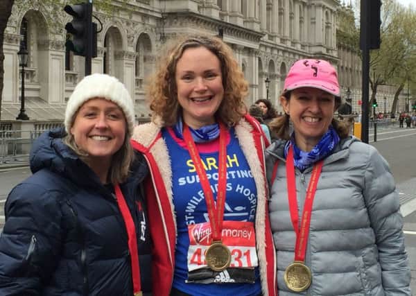 The Awesome Oaks, from left, Yvonne Lee, Sarah Mayhead and Catherine Hutchin, with their London Marathon medals