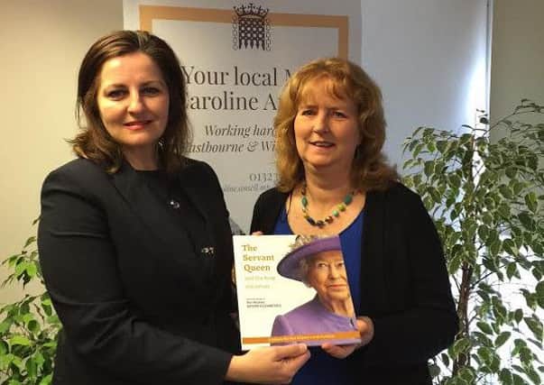 Eastbourne author Catherine Butcher has presented local MP Caroline Ansell with a copy of her latest book published to mark the Queens 90th birthday. SUS-160429-125824001