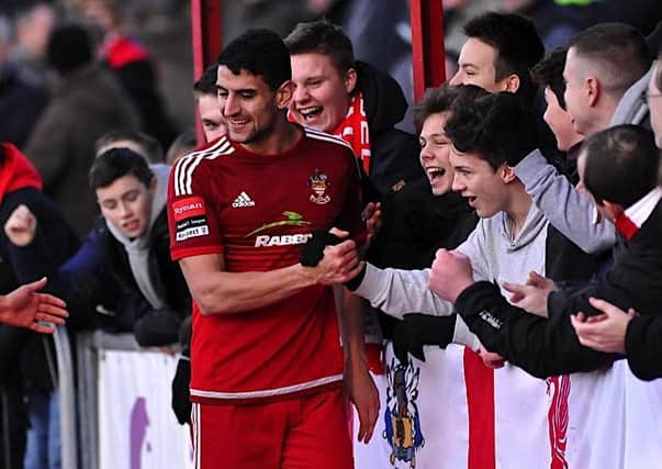 Omar Bugiel celebrates with the Worthing fans