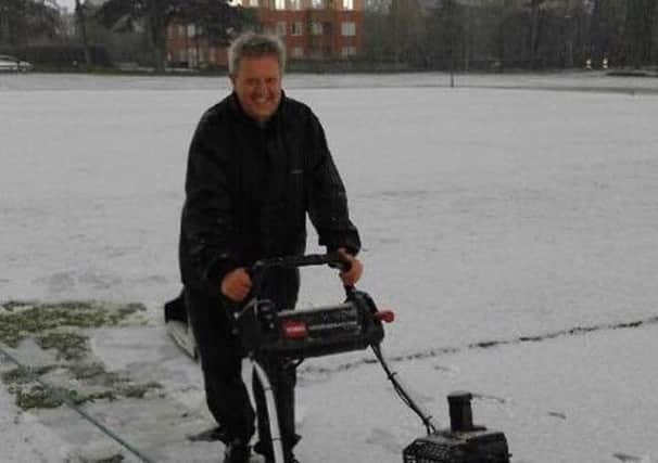 Geoff Brailey, Burgess Hill CC's Club Secretary and Assistant Groundsman preparing the wicket in the snow CElecLiv_czx7LiftFyC