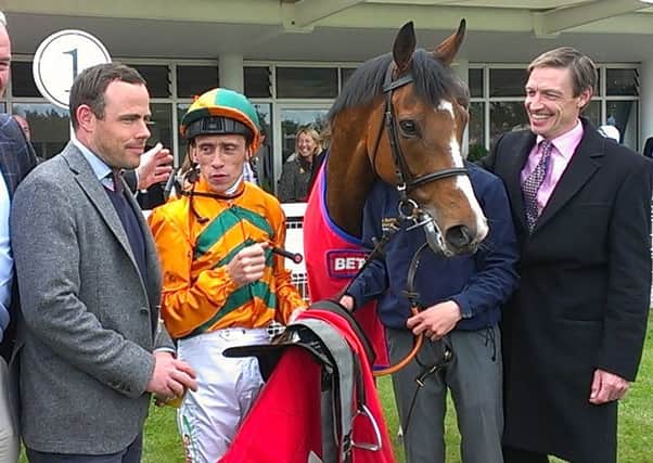 Richard Hughes and connections with Russian Realm - his first Goodwood winner as a trainer / Picture by Steve Bone