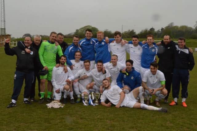 The Haywards Heath team show off their two trophies. Picture by Grahame Lehkyj