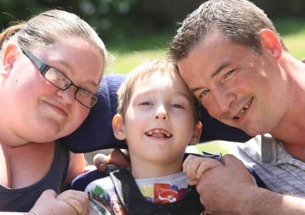 DM16117559a.jpg Compensation for brain damaged boy Thomas 7, pictured with his parents Samantha and Christopher Hord. Photo by Derek Martin SUS-160515-184705008