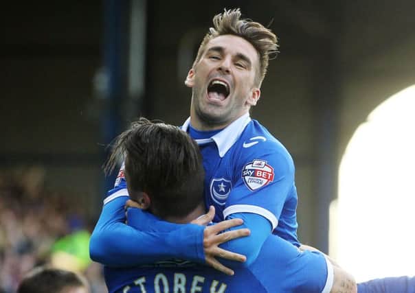 Ricky Holmes, celebrating a goal with with Miles Storey, enjoyed his time at Fratton Park even though his stay there was cut short