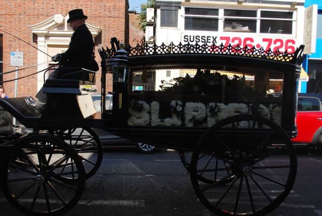 I loved this photo of Chris Islip's funeral this week as the horse-drawn hearse passed by Sussex Cars