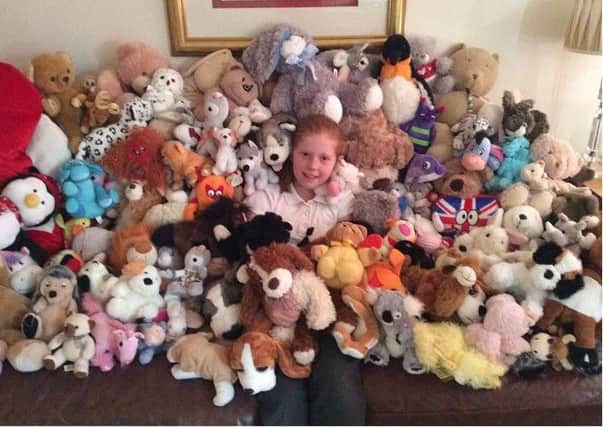Caitlin Sullivan from Rudgwick with the teddies she re-homed to raise funds for Alzheimer's Society