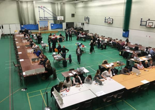 Counters prepared to start going through the votes at Horntye Park SUS-160505-222109001