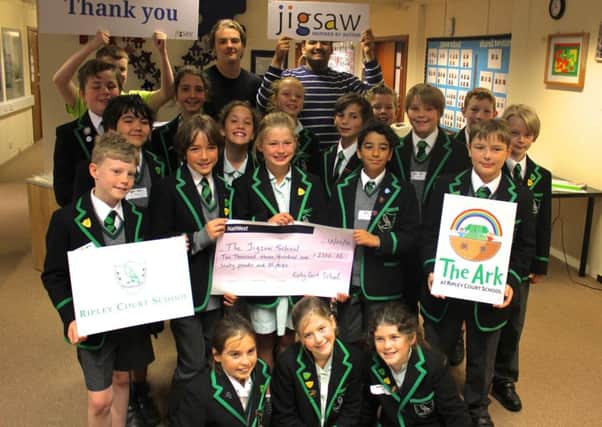 Pupils with the cheque for Jigsaw