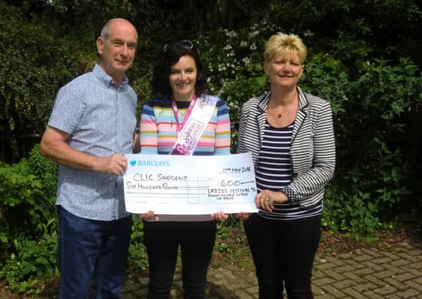 Richard Collyer Masons donating the cheque to Clic Sargent