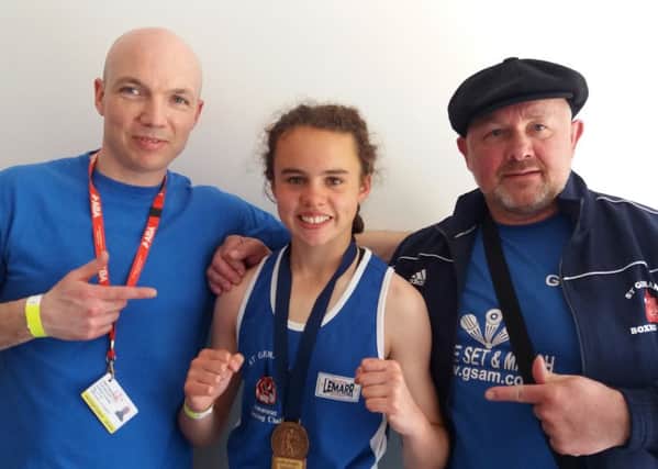 Holly Heffron with coaches Jon Mills and Gerry Lavelle