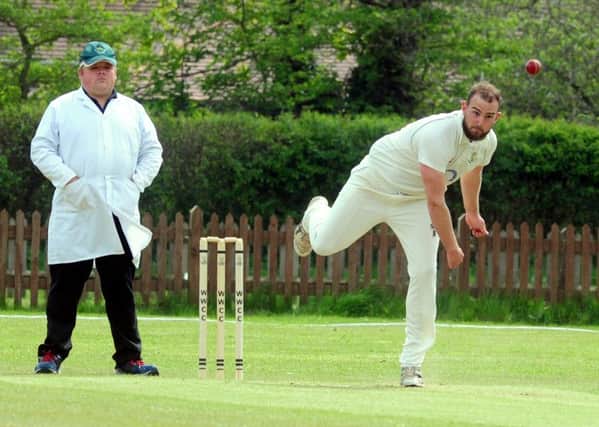 Carl Tupper bowling for West Wittering in a recent game against Scaynes Hill / Picture by Kate Shemilt
