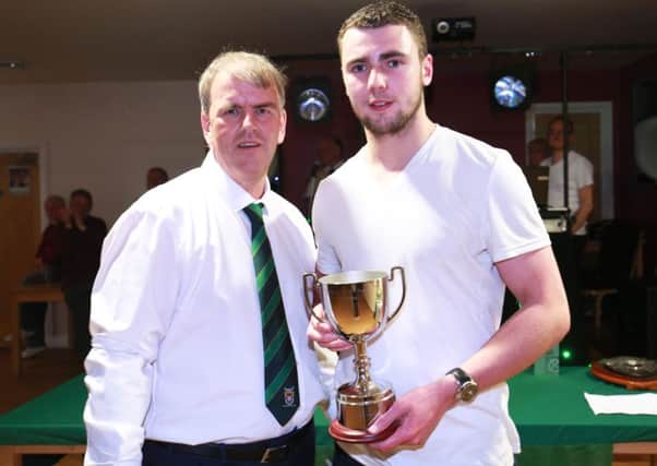 Grant Smith receives the supporters' player of the season award from David Seabourne / Picture by Tim Hale