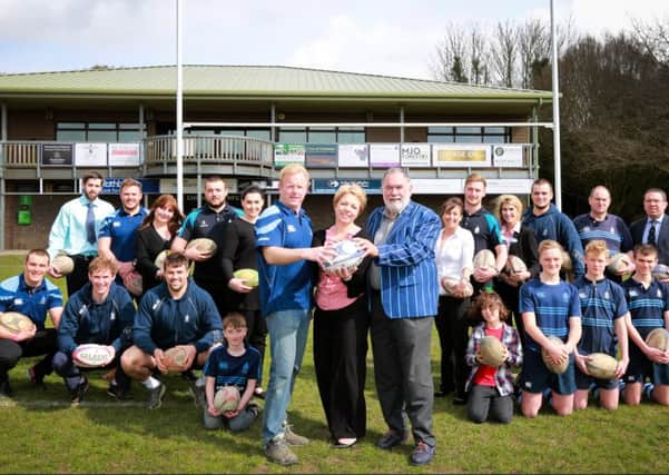 Clare Gibson, Home Manager of Colten Care's Wellington Grange, with (left) Declan Hutchings, CRFC Chairman and Ron Migliorini, Sponsorship Head, with Wellington Grange staff and CRFC players