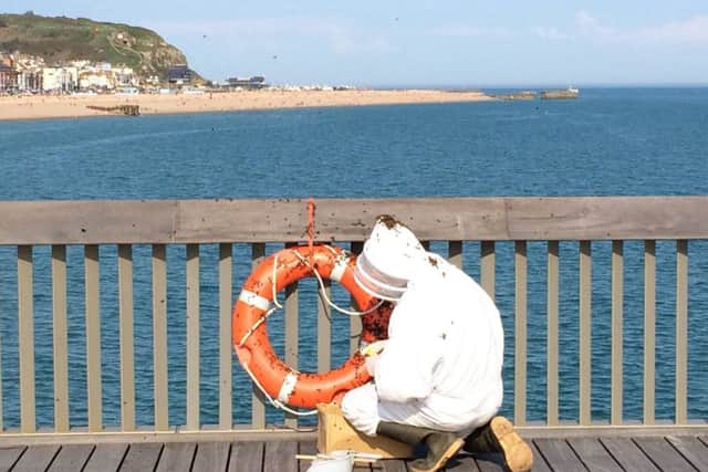 The bees seemed to be attracted to the brightly-coloured life bouy. Photo courtesy of Hastings Pier Charity