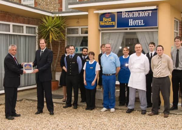 Robert Warham (far left) alongside staff at the Beachcroft Hotel in 2013 being handed one of the many awards it won