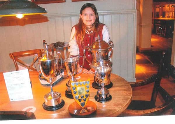 Megan Bryant-Lawson with her trophies