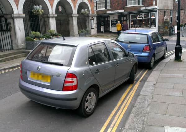 Cars regularly park on double yellow lines in the town centre as there is no enforcement