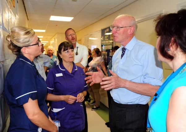 Lord Prior speaking to ward sister Johanne Midgley. Picture: Kate Shemilt