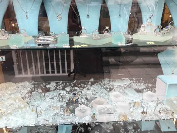The window of David Smith Jewellery was smashed during the raid. SUS-161105-155755001
