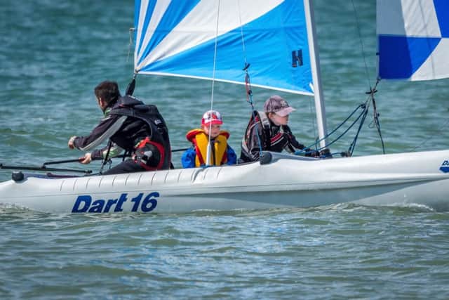 Max Cholerton and Lucas Terry win their race at Hastings & St Leonards Sailing Club under the guidance of Simon Terry MBE