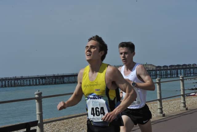 Runner-up Christopher Zablocki (yellow vest) and winner Ross Skelton (white vest) approach the four-mile mark (SUS-160805-201335002)