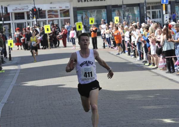 Ross Skelton comes home to win the 11th annual Hastings Runners Five-Mile Race in a course record time. Picture by Simon Newstead (SUS-160805-201425002)
