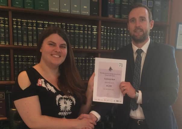 Laura Mead (Christian Aid) thanks James Winfield, Partner, Lewis & Dick Solicitors, for their fundraising during Will Aid Week - picture submitted