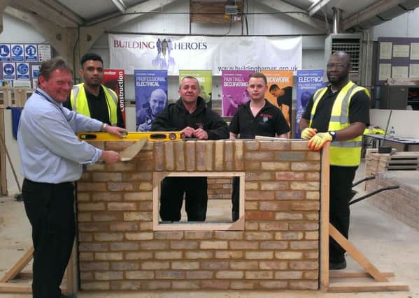 Mike Sheldrick, course lecturer and deputy head of learning, with veterans on the inaugural Building Heroes course