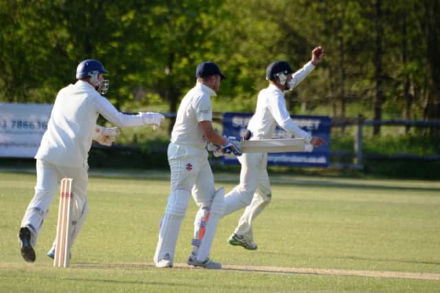 Shawn Johnson celerbates after taking a brilliant one-handed catch for Bexhill Cricket Club against Billingshurst last weekend. Picture courtesy Andy Hodder