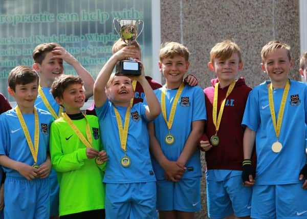 Ifield Galaxy U10s lift the Horsham Youth League Cup SUS-160515-222724002
