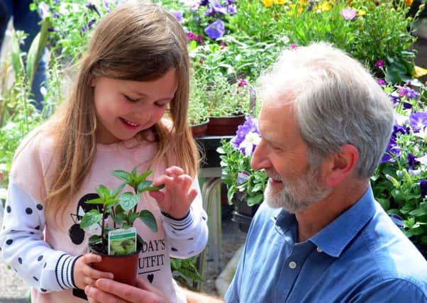 James Windsor looking at plants with his granddaughter Alexia, six. Pictures: Kate Shemilt ks16000633-4