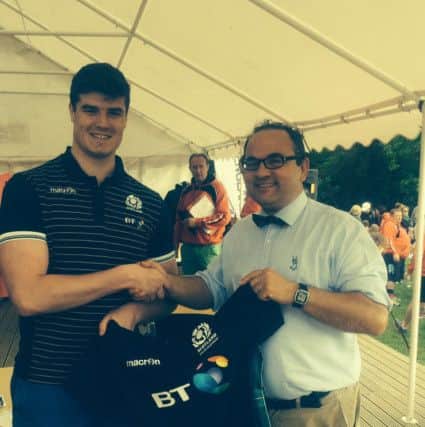 Jamie Ure presented his Scotland U19 shirt to the Heath Chairman, Mark Newey