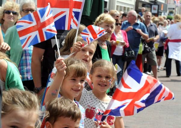 Crowds lining the streets of Chichester during the gala procession in 2012. ENGSUS00120120206155616