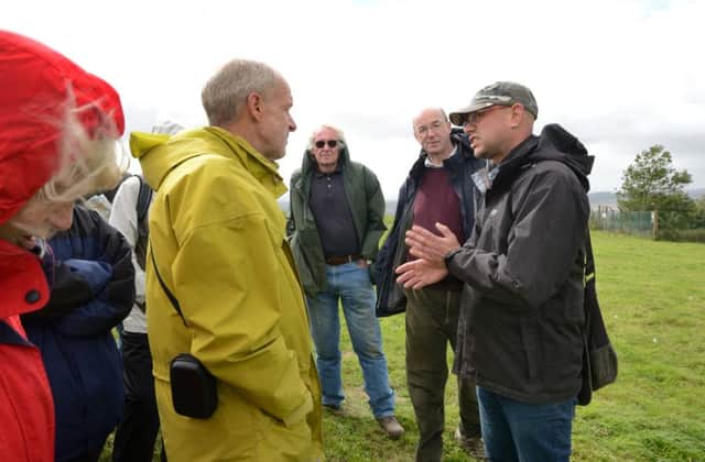 SDNPA guided archaeology walk for volunteers of the Secrets of the High Woods project on the Trundle, also: St Roche's Hill near Goodwood, West Sussex, on September 14, 2015.
(also: on the route of the Monarch's Way)

Jon Sygrave (right)
James McInnes (second right)
Mark Seaman (yellow jacket)